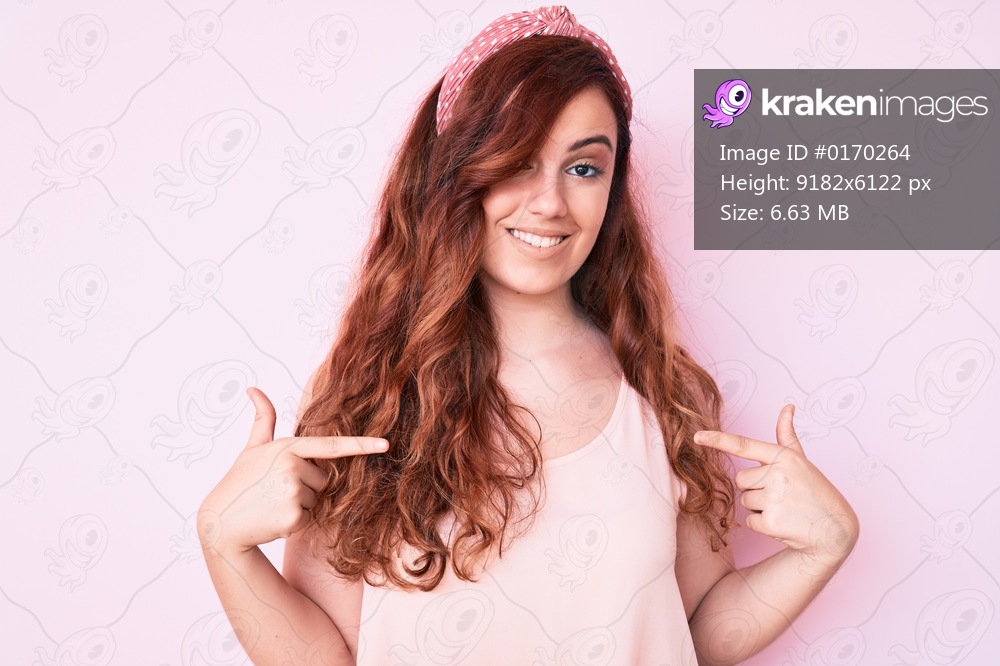 Young beautiful woman wearing casual clothes looking confident with smile on face, pointing oneself with fingers proud and happy. 