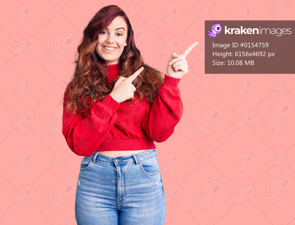 Young beautiful woman wearing casual winter sweater smiling and looking at the camera pointing with two hands and fingers to the side. 