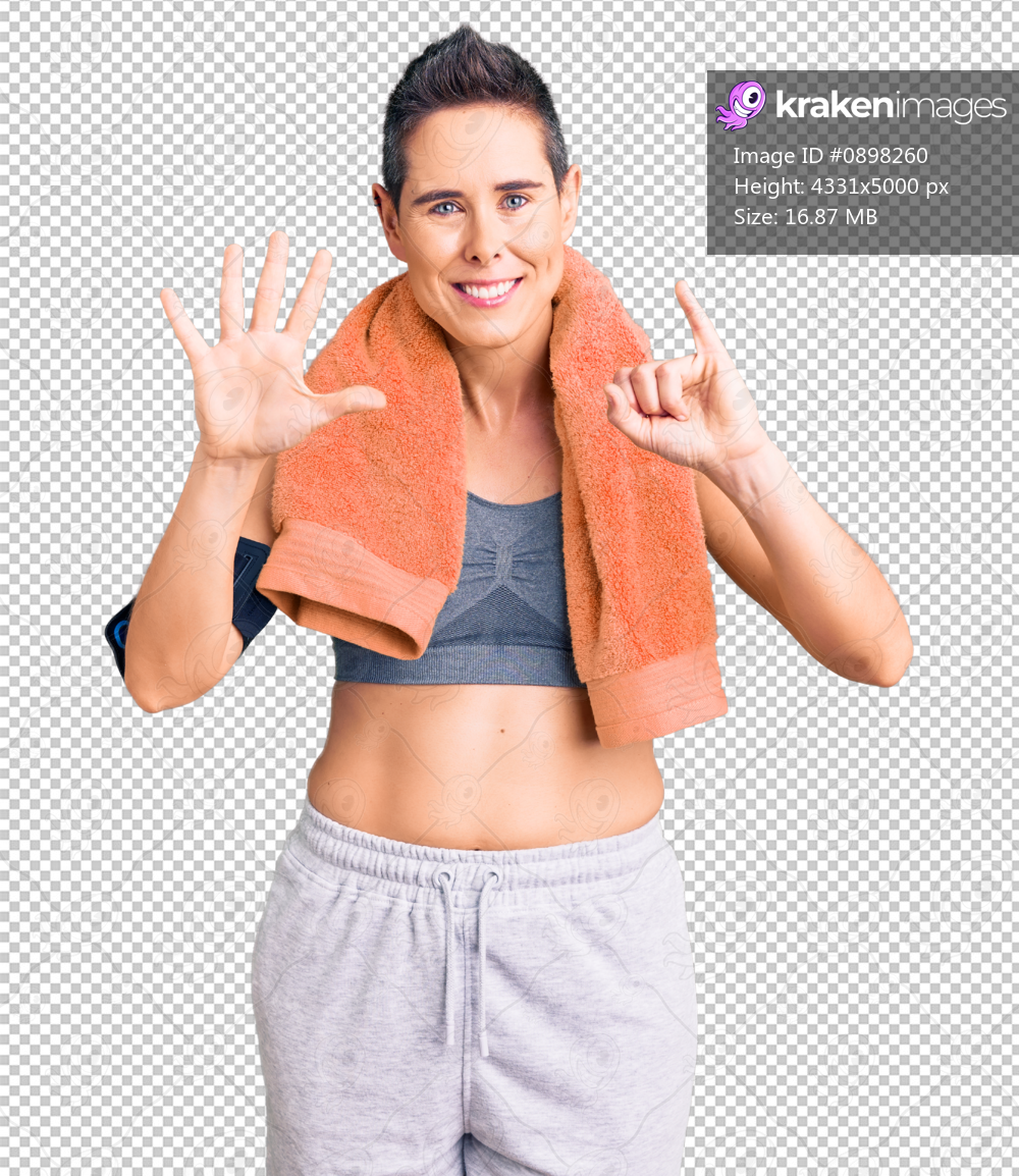Young woman with short hair wearing sportswear and towel using smartphone showing and pointing up with fingers number six while smiling confident and happy.