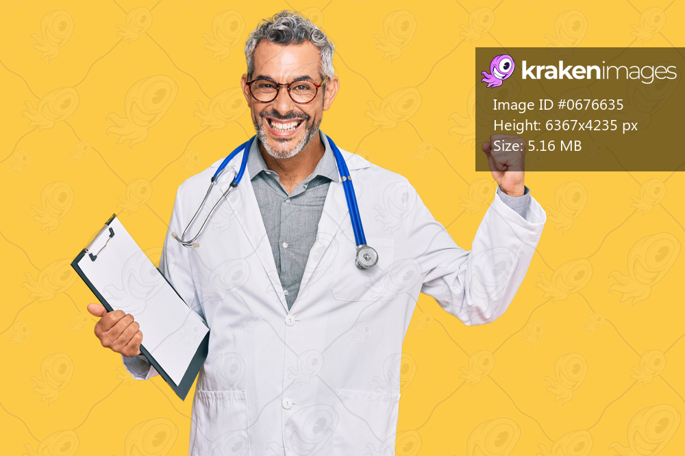 Middle age grey-haired man wearing doctor stethoscope holding clipboard screaming proud, celebrating victory and success very excited with raised arms 