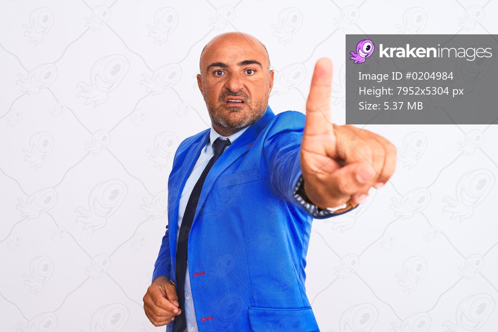 Middle age businessman wearing suit standing over isolated white background Rejection expression crossing arms doing negative sign, angry face