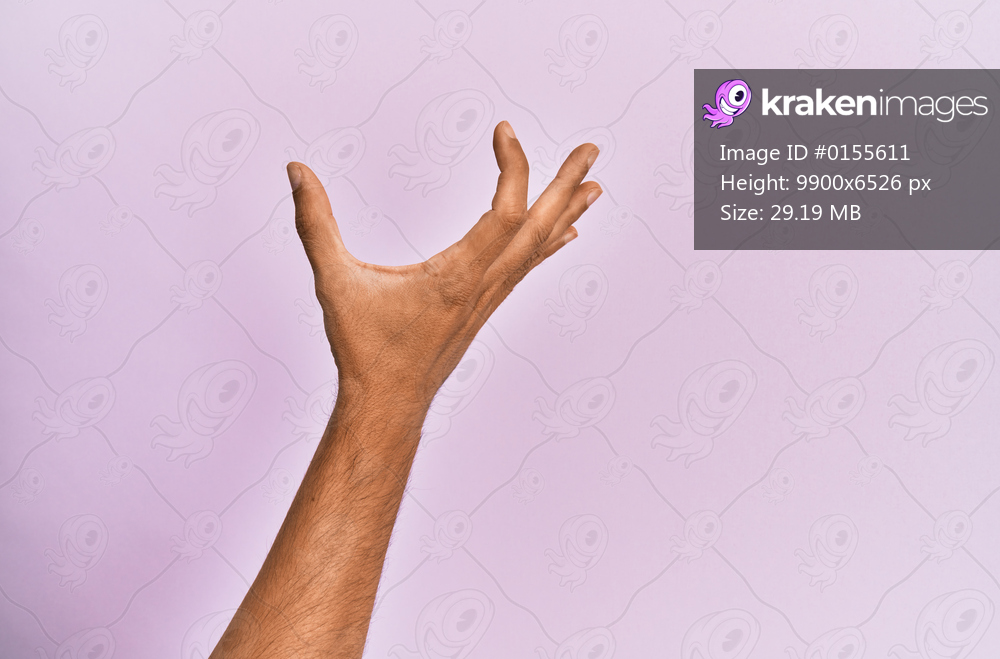 Arm and hand of caucasian young man over pink isolated background picking and taking invisible thing, holding object with fingers showing space 