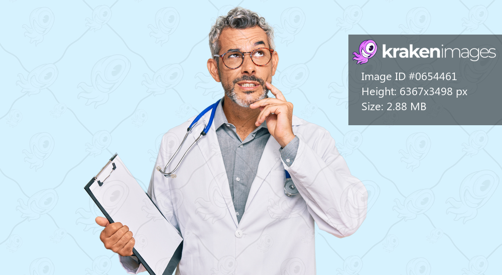 Middle age grey-haired man wearing doctor stethoscope holding clipboard serious face thinking about question with hand on chin, thoughtful about confusing idea 