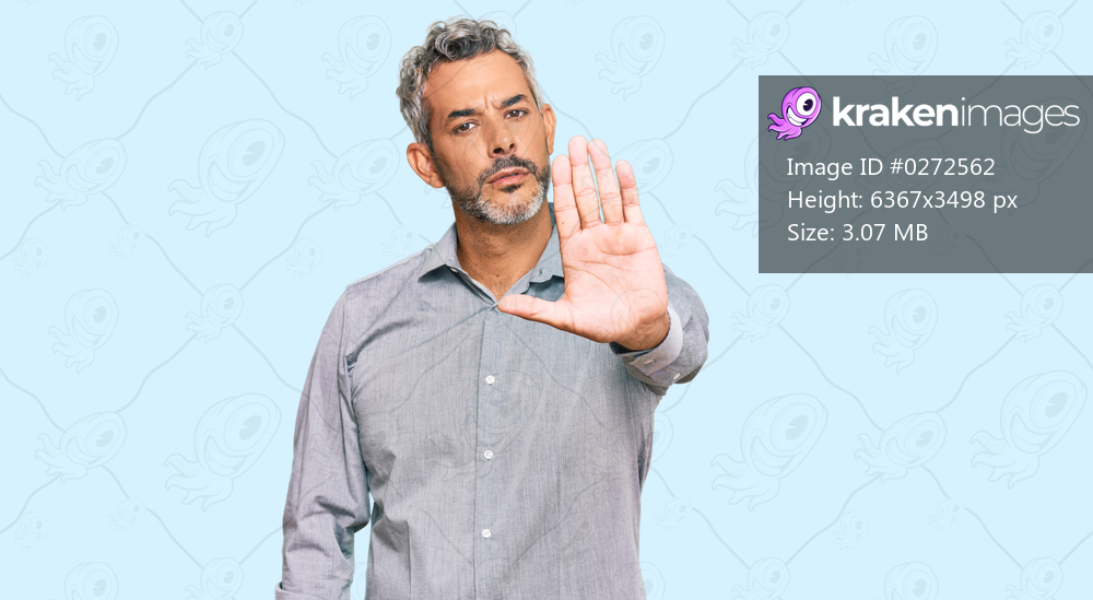 Middle age grey-haired man wearing casual clothes doing stop sing with palm of the hand. warning expression with negative and serious gesture on the face. 