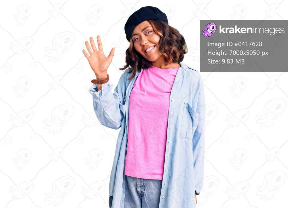 Young beautiful mixed race woman wearing french look with beret showing and pointing up with fingers number five while smiling confident and happy. 