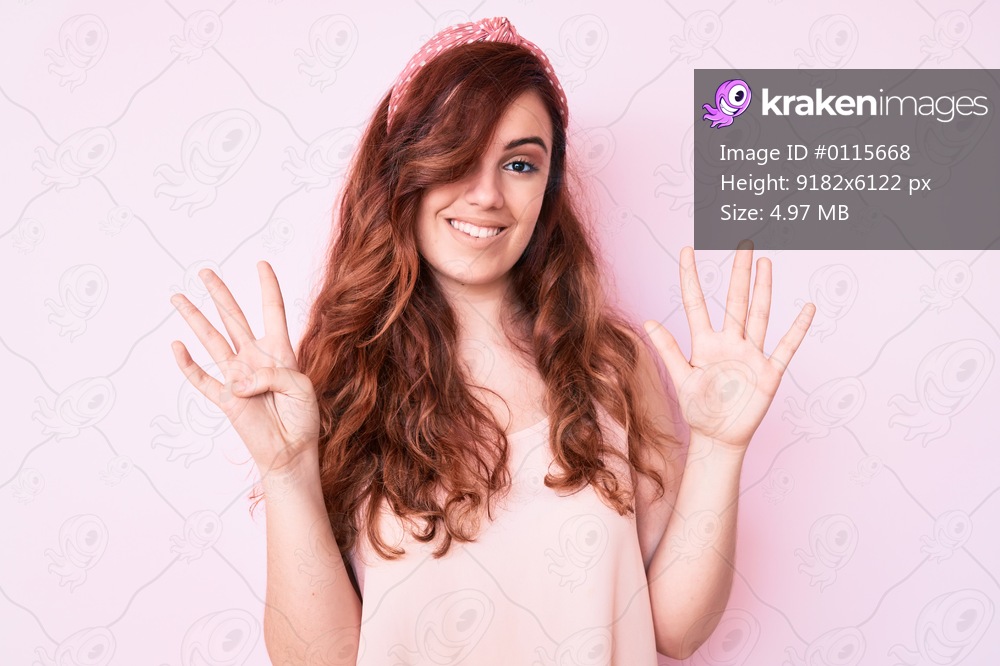 Young beautiful woman wearing casual clothes showing and pointing up with fingers number nine while smiling confident and happy. 
