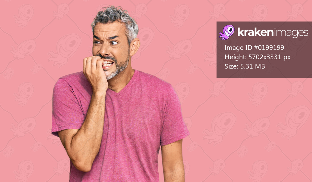 Middle age grey-haired man wearing casual clothes looking stressed and nervous with hands on mouth biting nails. anxiety problem. 