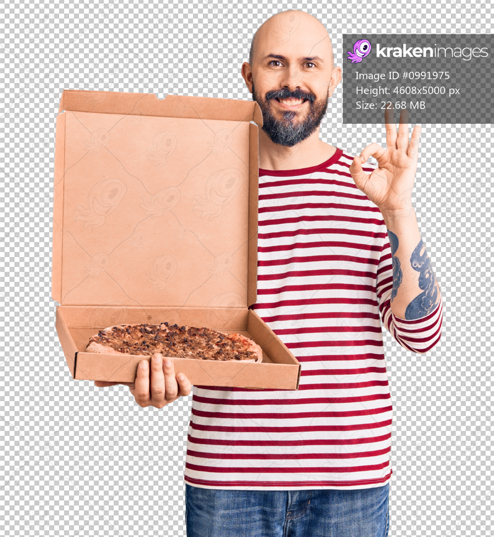 Young handsome man holding delivery pizza box doing ok sign with fingers, smiling friendly gesturing excellent symbol