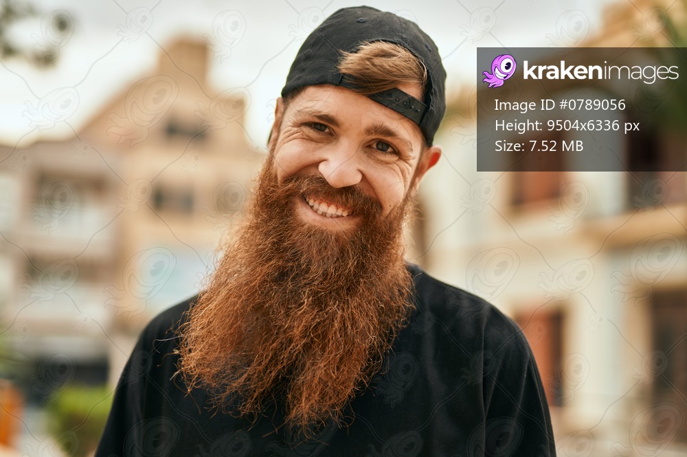 Young irish hipster man smiling happy standing at the city.