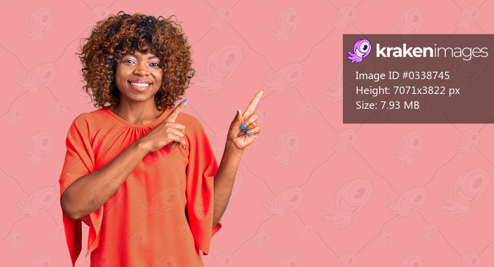 Young african american woman wearing casual clothes smiling and looking at the camera pointing with two hands and fingers to the side. 