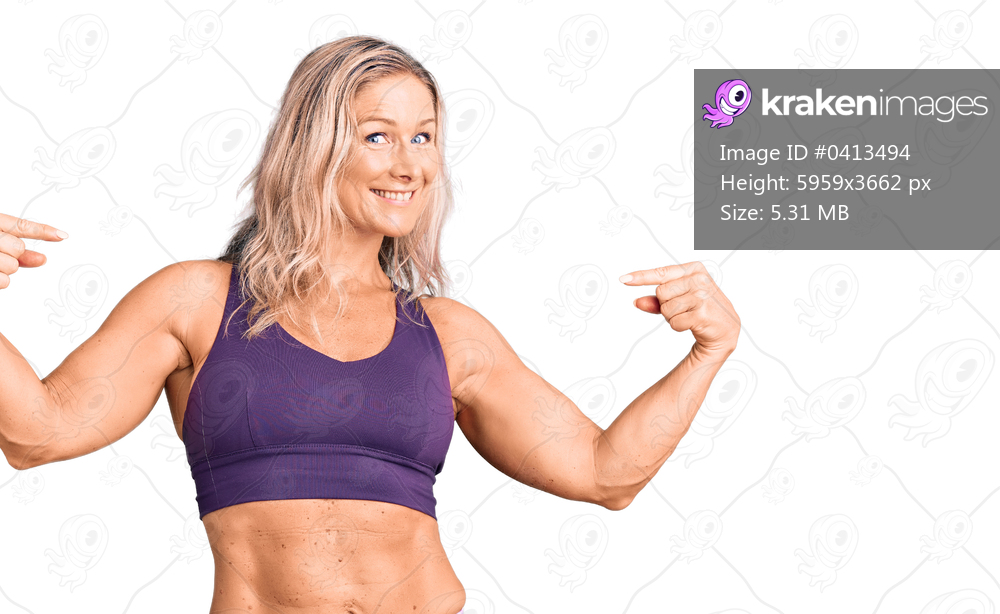 Middle age fit blonde woman wearing sportswear looking confident with smile on face, pointing oneself with fingers proud and happy. 