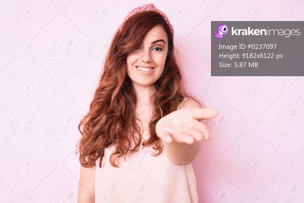 Young beautiful woman wearing casual clothes smiling cheerful offering palm hand giving assistance and acceptance. 