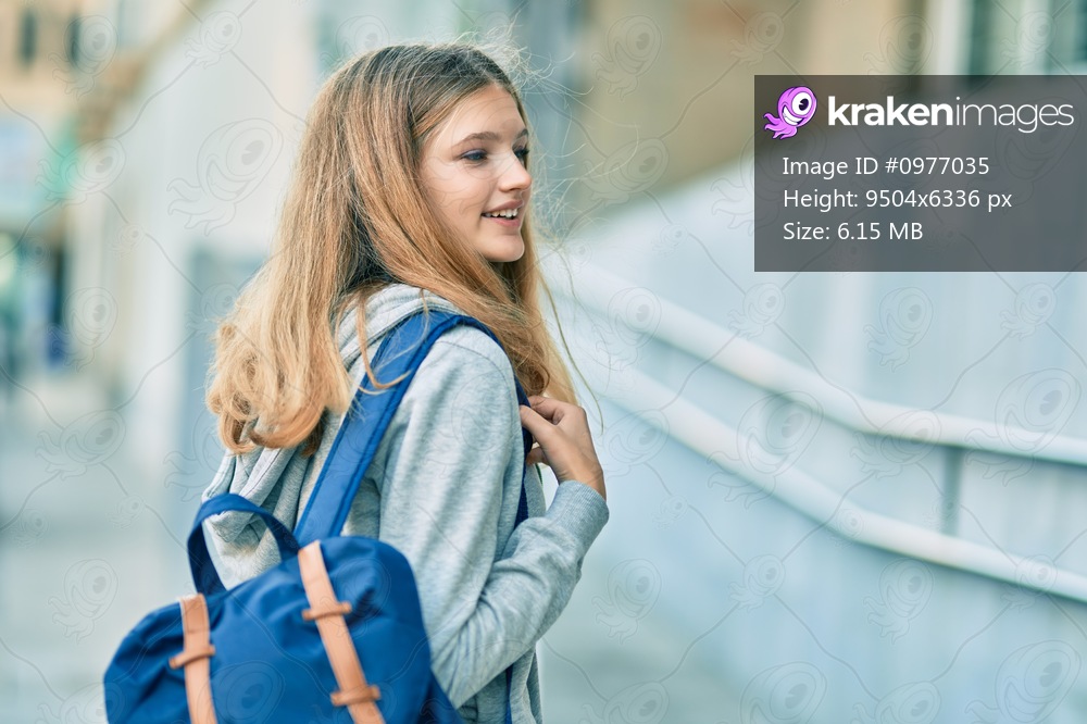 Beautiful caucasian student teenager smiling happy at the college.