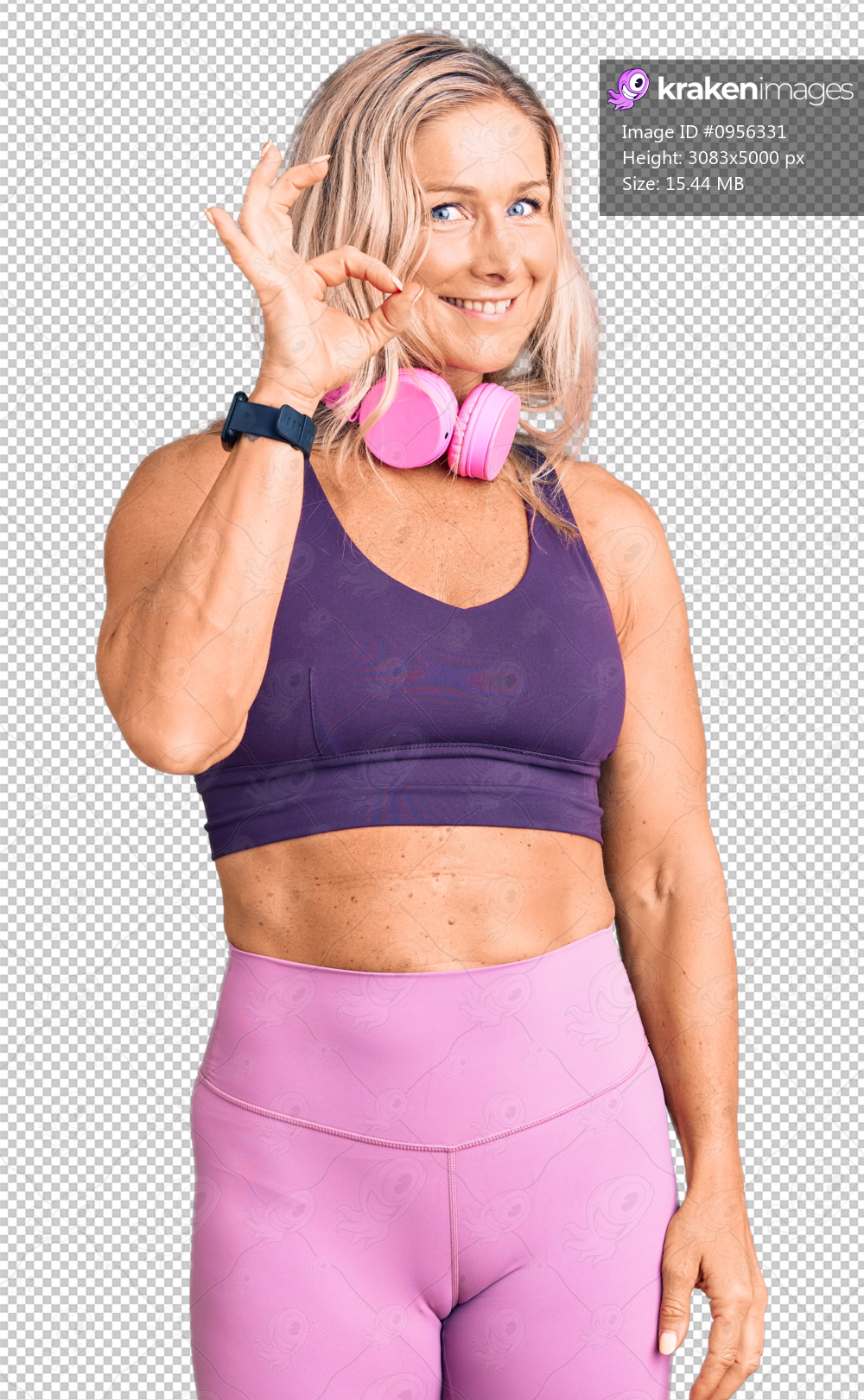 Middle age fit blonde woman wearing gym clothes and using headphones smiling positive doing ok sign with hand and fingers. successful expression.