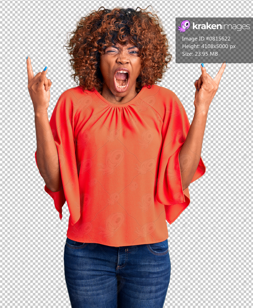 Young african american woman wearing casual clothes shouting with crazy expression doing rock symbol with hands up. music star. heavy concept.