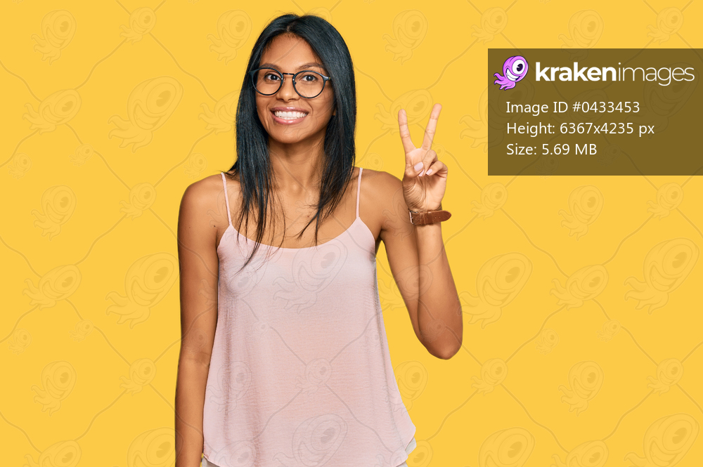 Young african american woman wearing casual clothes and glasses showing and pointing up with fingers number two while smiling confident and happy. 