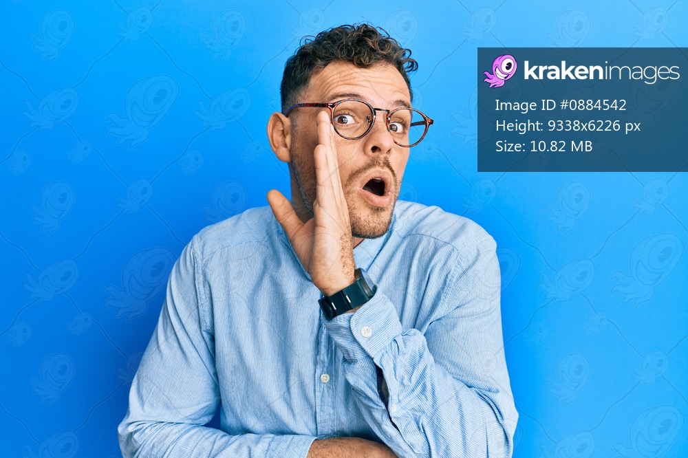 Young hispanic man wearing casual clothes and glasses hand on mouth telling secret rumor, whispering malicious talk conversation 