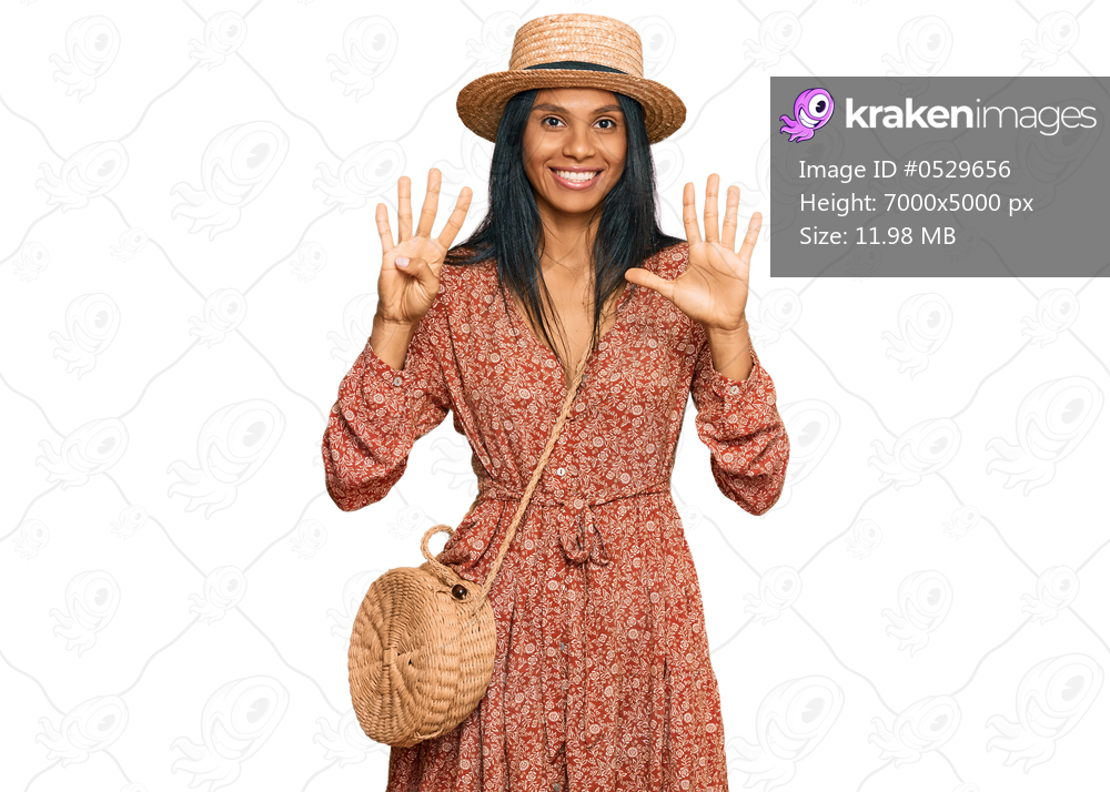 Young african american woman wearing summer hat showing and pointing up with fingers number nine while smiling confident and happy. 