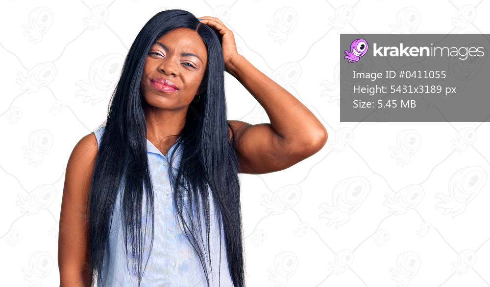 Young african american woman wearing casual clothes confuse and wonder about question. uncertain with doubt, thinking with hand on head. pensive concept. 