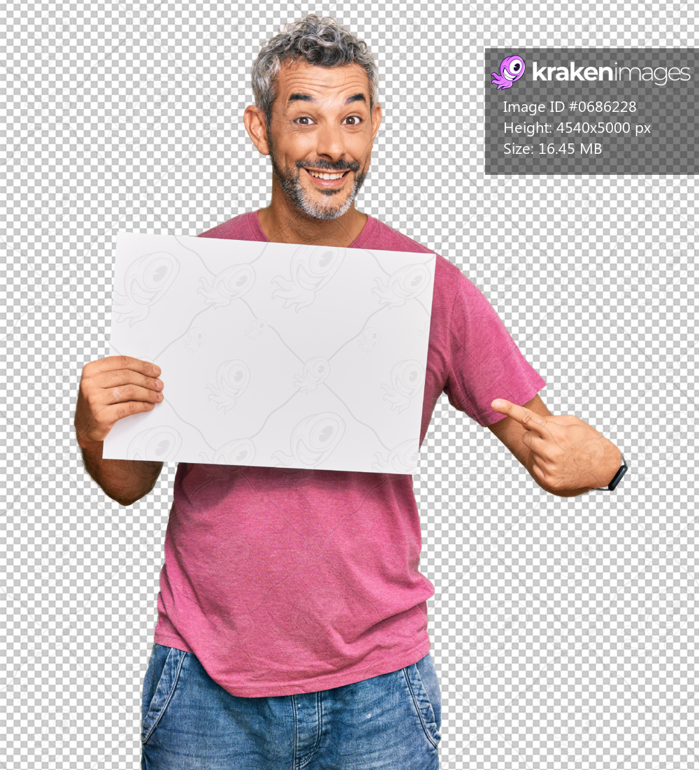Middle age grey-haired man holding blank empty banner smiling happy pointing with hand and finger
