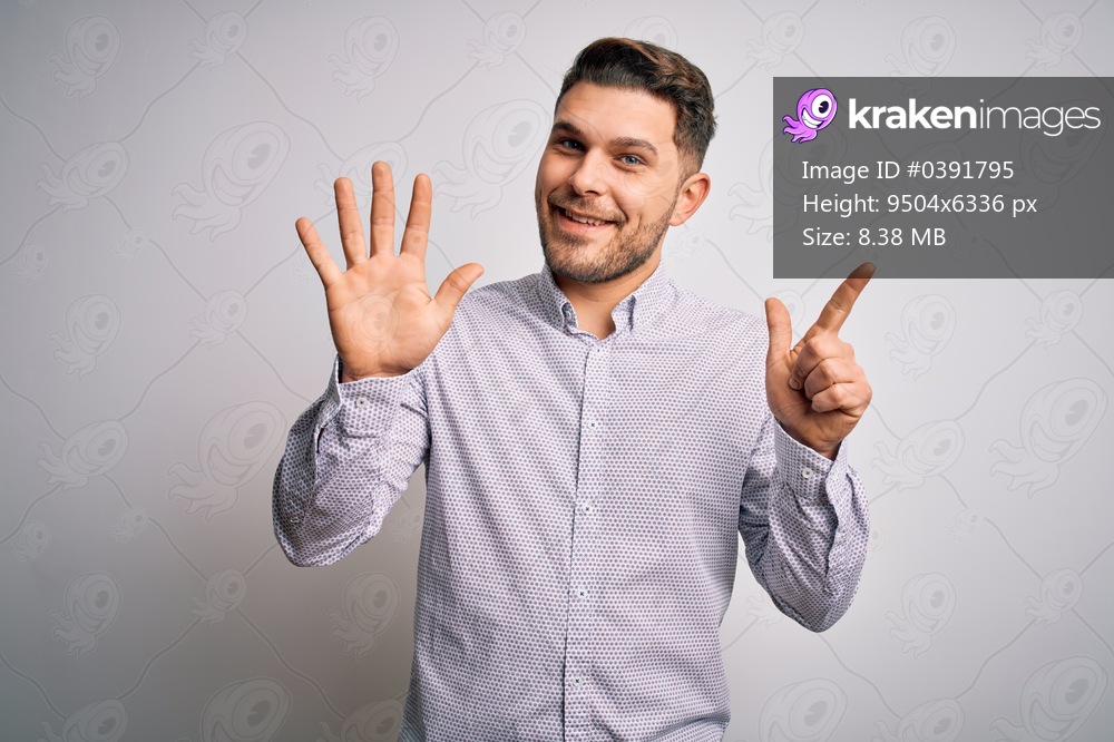 Young business man with blue eyes standing over isolated background showing and pointing up with fingers number seven while smiling confident and happy.