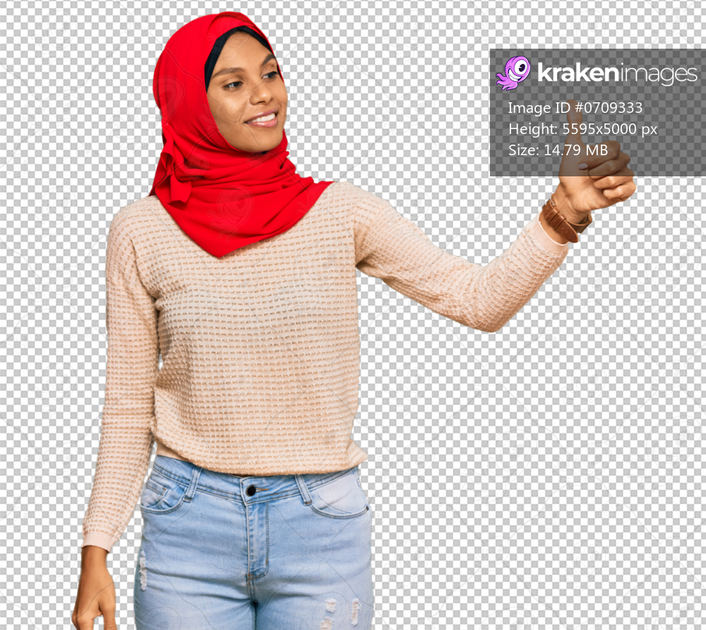 Young african american woman wearing traditional islamic hijab scarf looking proud, smiling doing thumbs up gesture to the side