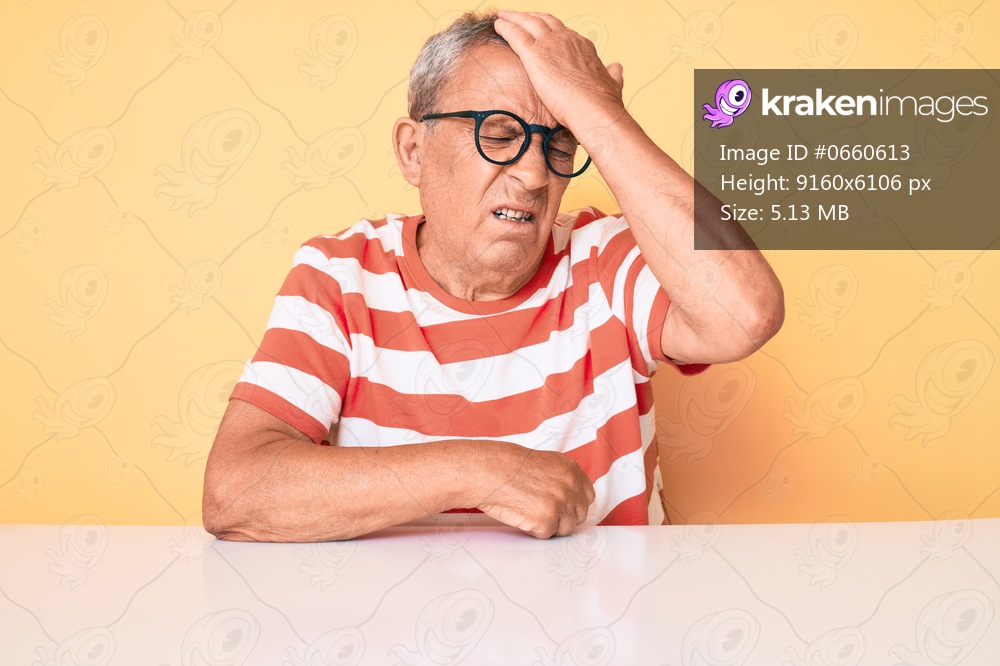 Senior handsome man with gray hair wearing casual clothes and glasses surprised with hand on head for mistake, remember error. forgot, bad memory concept. 