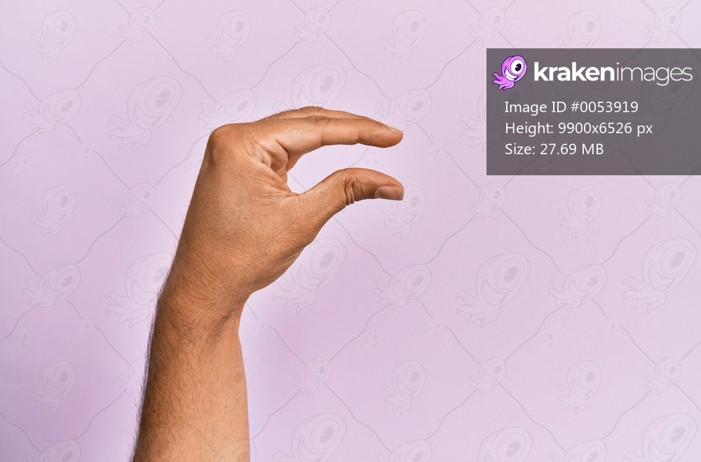 Arm and hand of caucasian young man over pink isolated background picking and taking invisible thing, holding object with fingers showing space 