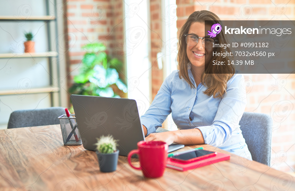 Young business woman sitting at desk working using computer laptop, modern executive girl at the office