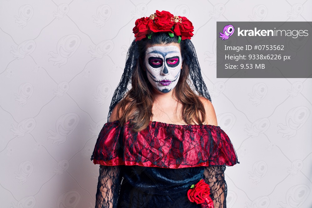 Young woman wearing day of the dead costume over white skeptic and nervous, frowning upset because of problem. negative person. 