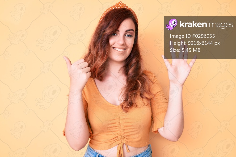Young beautiful woman wearing casual clothes showing and pointing up with fingers number six while smiling confident and happy. 