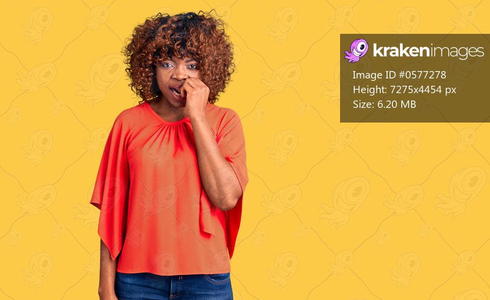 Young african american woman wearing casual clothes looking stressed and nervous with hands on mouth biting nails. anxiety problem. 