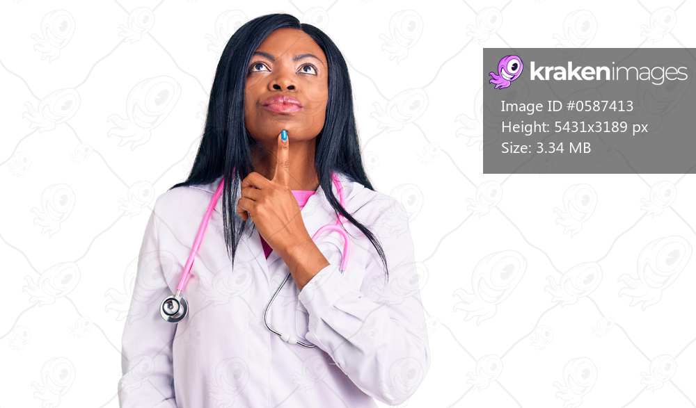 Young african american woman wearing doctor stethoscope thinking concentrated about doubt with finger on chin and looking up wondering 