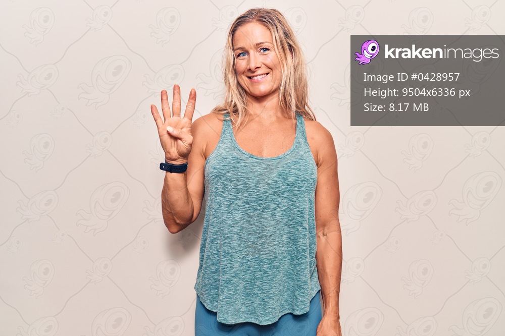 Middle age caucasian blonde woman wearing sportswear showing and pointing up with fingers number four while smiling confident and happy. 