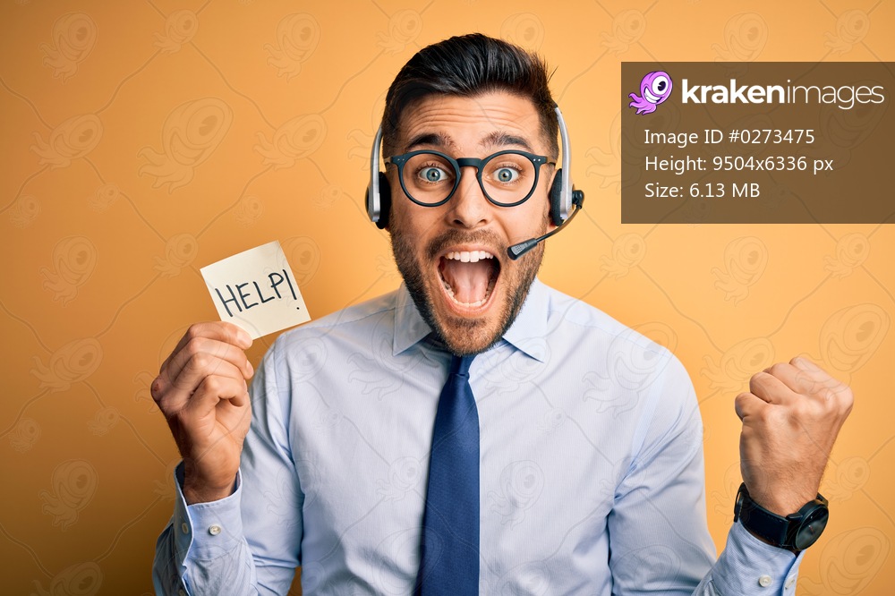 Business operator man with customer service headset from call center offering help and support screaming proud and celebrating victory and success very excited, cheering emotion