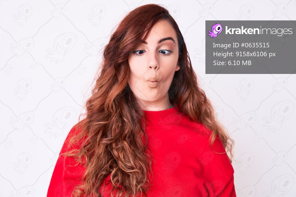 Young beautiful woman wearing casual clothes making fish face with lips, crazy and comical gesture. funny expression. 