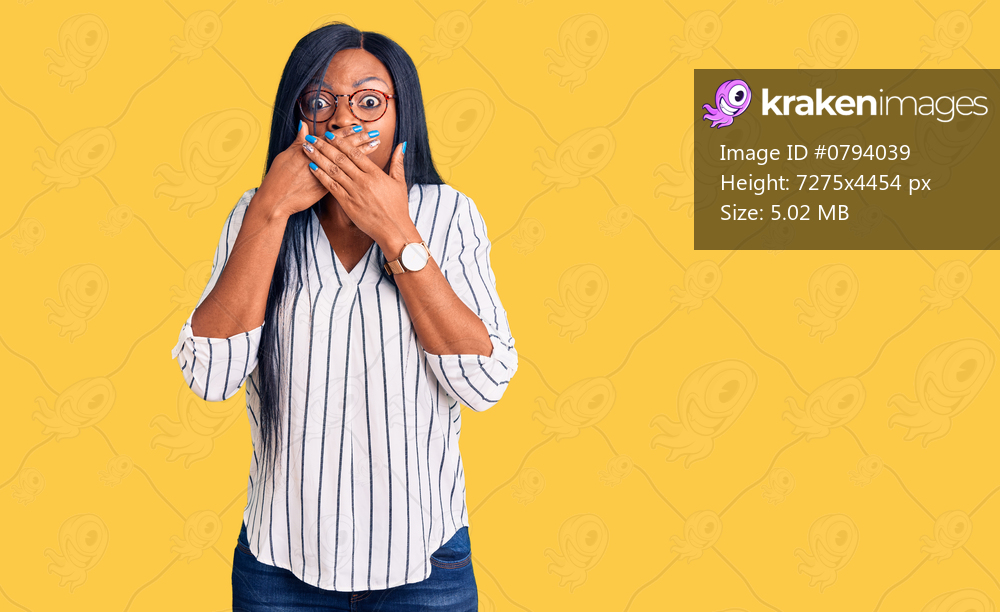 Young african american woman wearing casual clothes and glasses shocked covering mouth with hands for mistake. secret concept. 
