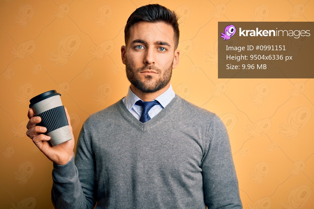 Young handsome man drinking a hot coffee from take away plastic cup over yellow background with a confident expression on smart face thinking serious