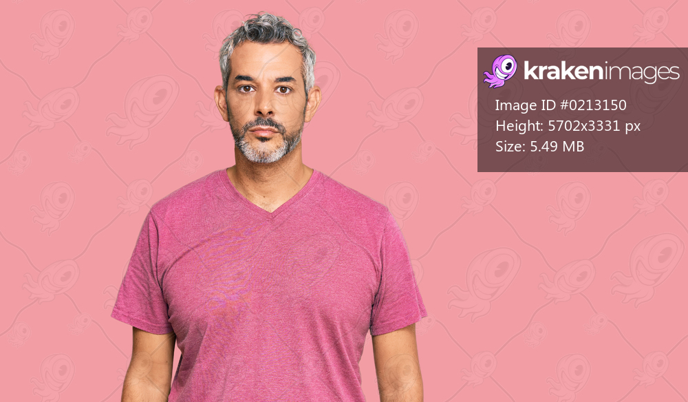 Middle age grey-haired man wearing casual clothes relaxed with serious expression on face. simple and natural looking at the camera. 