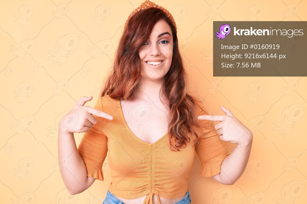 Young beautiful woman wearing casual clothes looking confident with smile on face, pointing oneself with fingers proud and happy. 