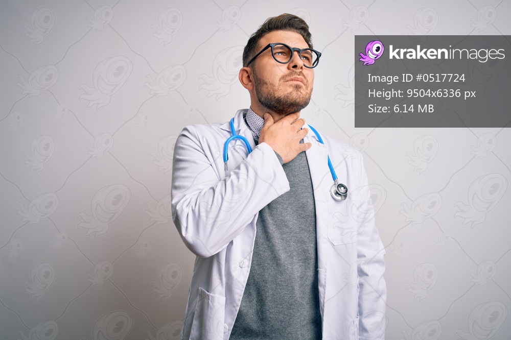 Young doctor man with blue eyes wearing medical coat and stethoscope over isolated background Touching painful neck, sore throat for flu, clod and infection