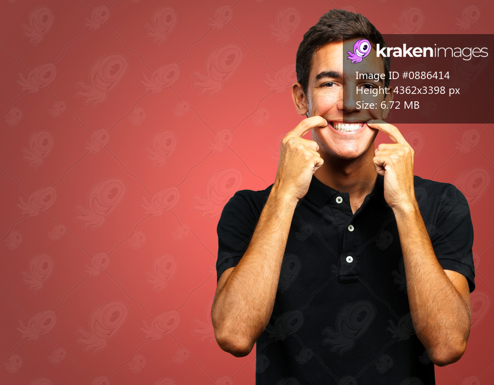 Portrait Of Happy A Boy against a red background