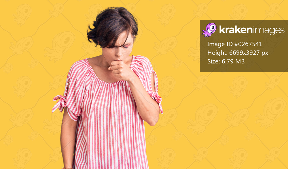 Beautiful young woman with short hair wearing casual summer clothes feeling unwell and coughing as symptom for cold or bronchitis. health care concept. 
