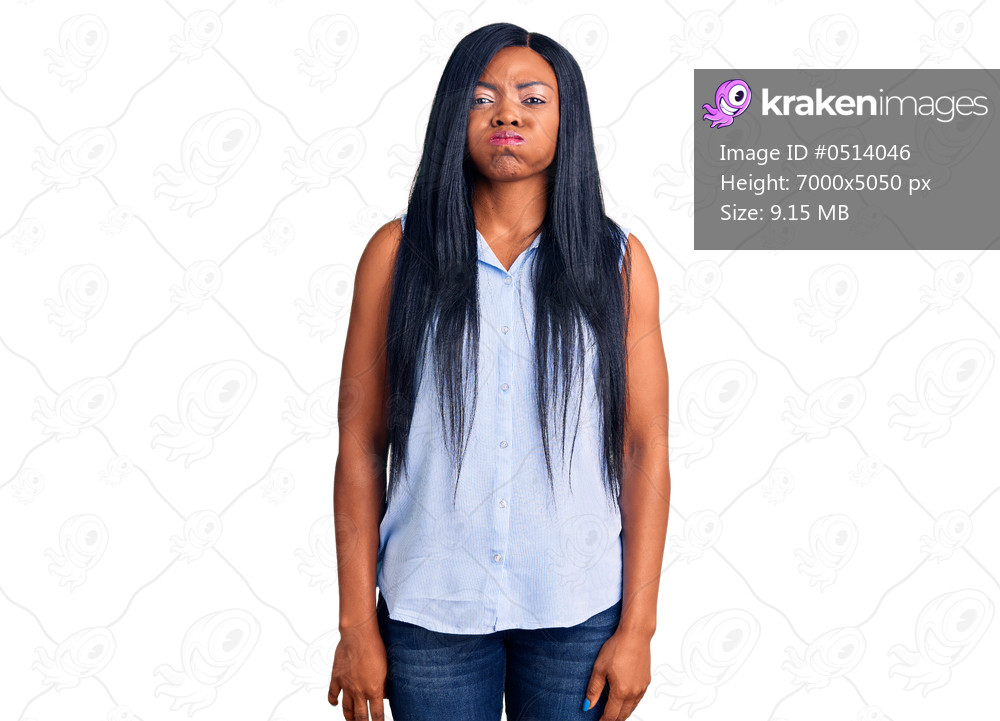 Young african american woman wearing casual clothes puffing cheeks with funny face. mouth inflated with air, crazy expression. 