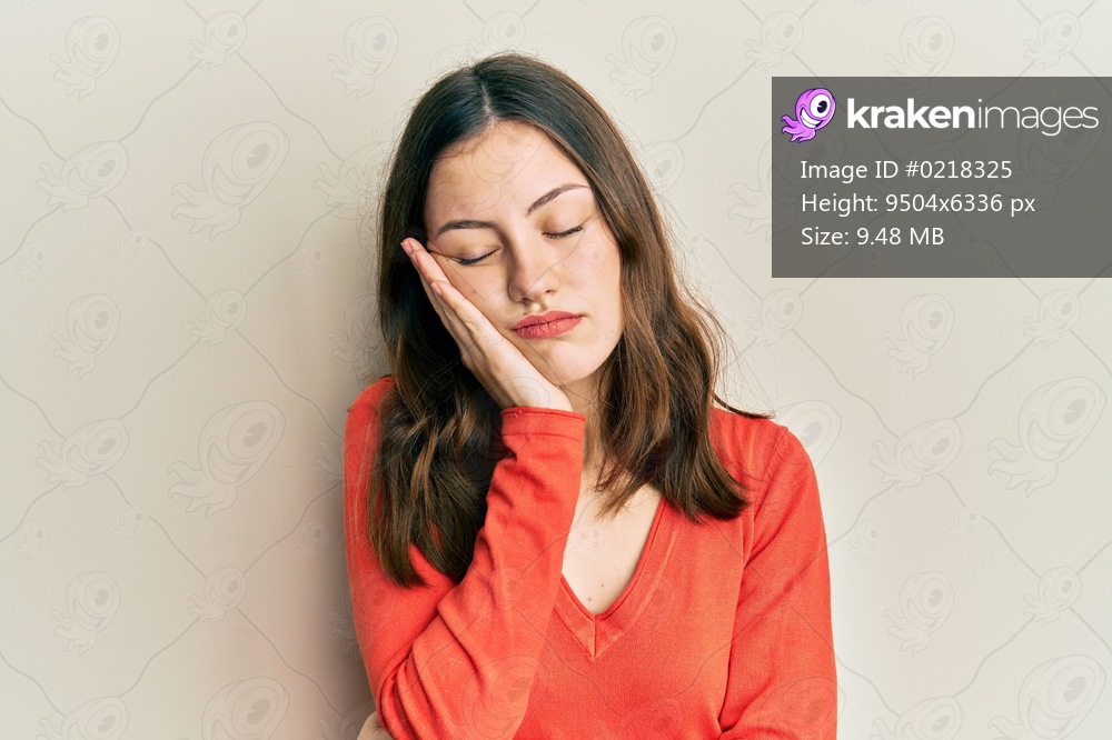 Young brunette woman wearing casual clothes thinking looking tired and bored with depression problems with crossed arms. 