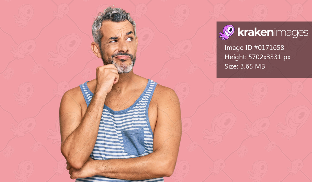 Middle age grey-haired man wearing casual style with sleeveless shirt serious face thinking about question with hand on chin, thoughtful about confusing idea 