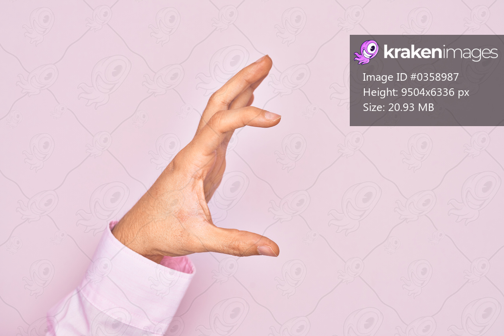 Hand of caucasian young man showing fingers over isolated pink background picking and taking invisible thing, holding object with fingers showing space