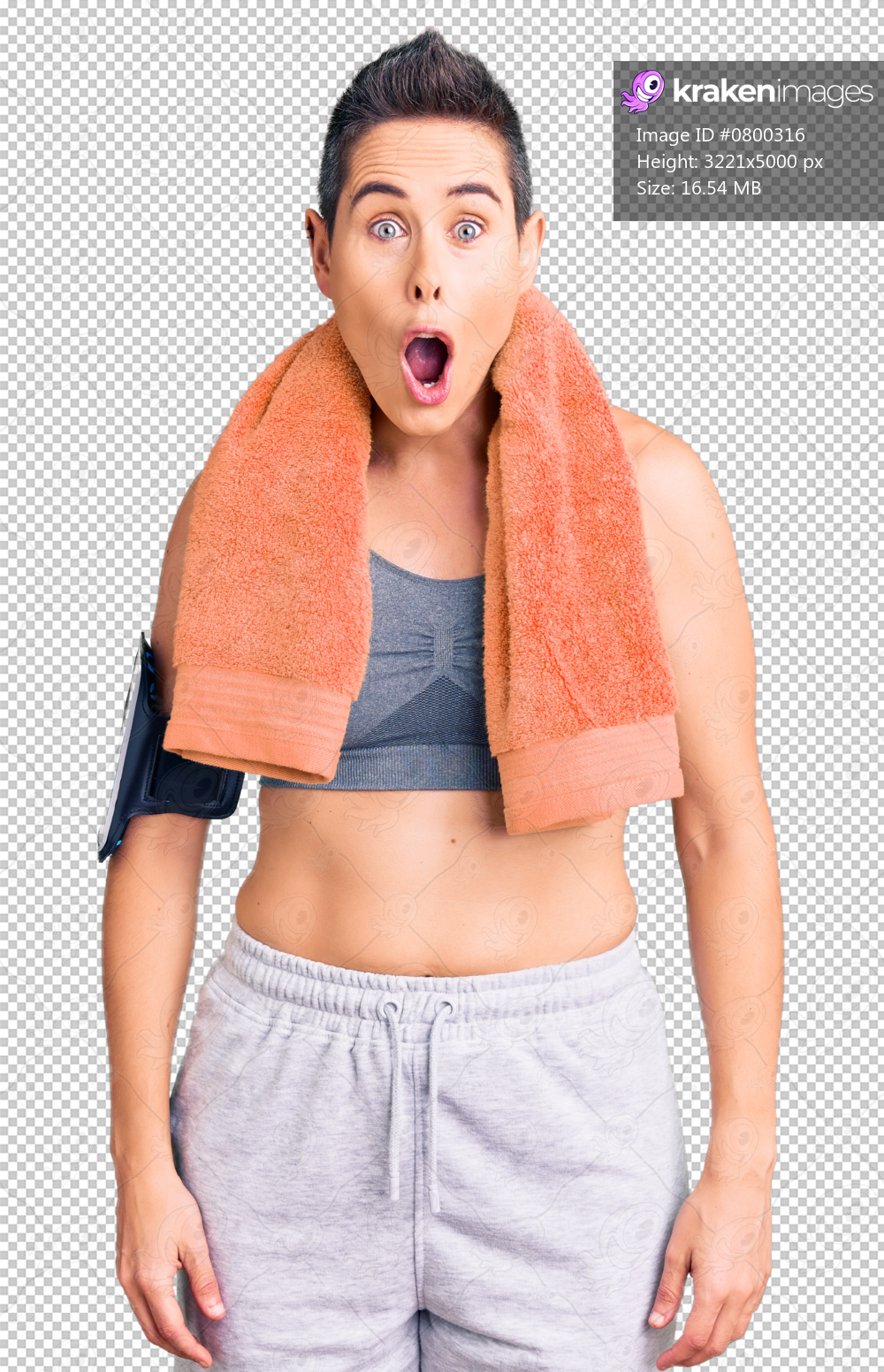 Young woman with short hair wearing sportswear and towel using smartphone afraid and shocked with surprise expression, fear and excited face.