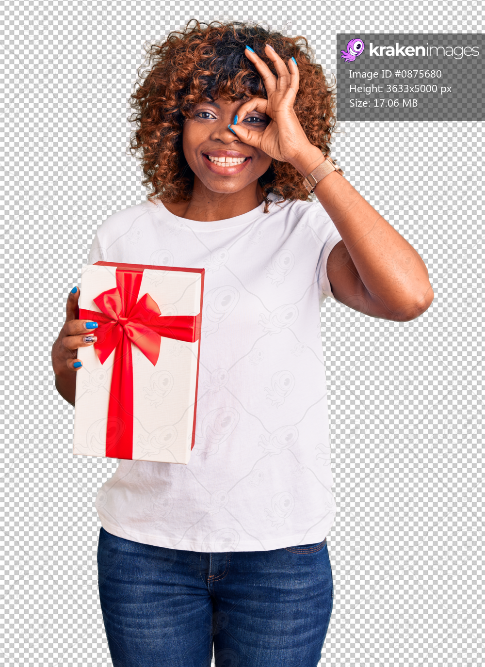 Young african american woman holding gift smiling happy doing ok sign with hand on eye looking through fingers