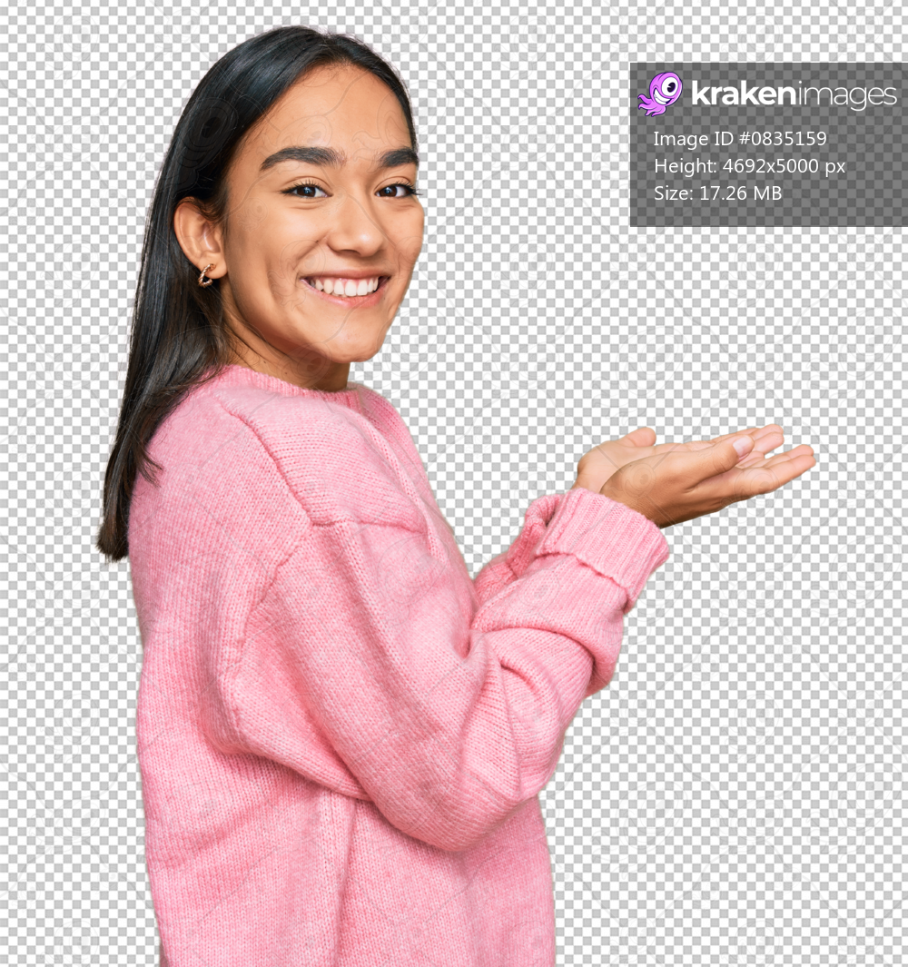 Young asian woman wearing casual winter sweater pointing aside with hands open palms showing copy space, presenting advertisement smiling excited happy
